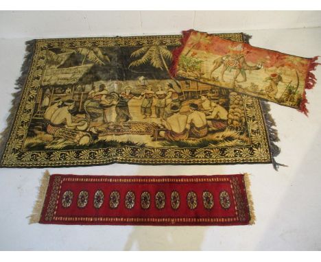 Two decorative wall hangings along with a small red ground runner