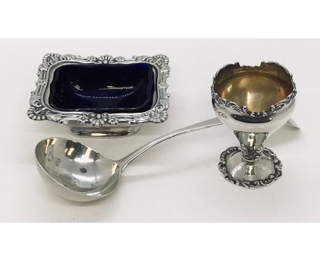 A hallmarked silver mustard with blue glass liner along with a silver egg cup and Georgian ladle