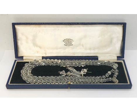 A vintage "crystal" double string necklace and earring set with silver clasp in fitted case along with an empty Christening s