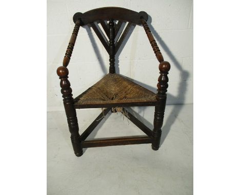 An African influenced bobbin turned rush seated chair