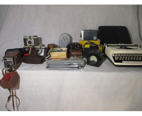 A collection of various cameras, Sperry Rand "Remington Premier" typewriter etc.