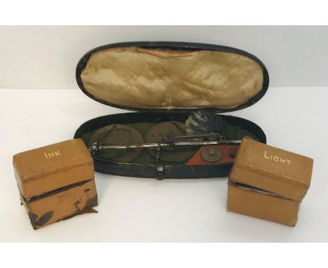 A cased set of hanging scales along with two travel inkwells