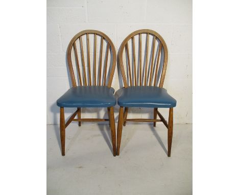 A pair of Ercol stickback chairs.