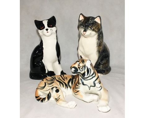 A Babbacombe pottery cat along along with a Price ceramic black and white cat and a ceramic tiger