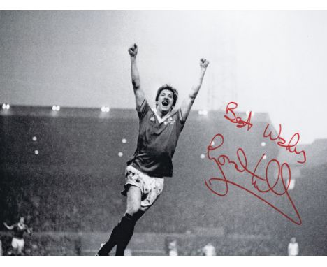 Autographed GORDON HILL 16 x 12 photo : B/W, depicting Manchester United winger GORDON HILL celebrating after scoring his sid
