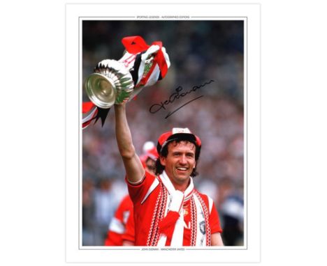 Autographed JOHN GIDMAN 16 x 12 photo-edition : Col, depicting Manchester United full-back JOHN GIDMAN holding aloft the FA C
