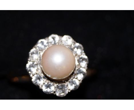 9ct Gold cluster ring with central simulated pearl surrounded by white stones. Size T
