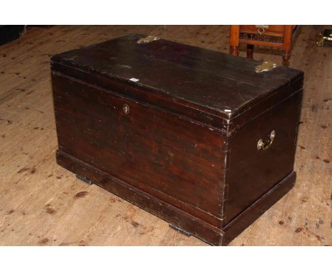 Stained pine trunk with brass fittings, 55cm by 91cm.