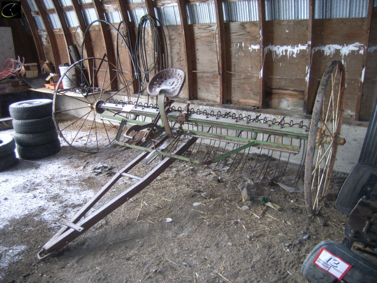 ANTIQUE HAY RAKE ON STEEL WHEELS