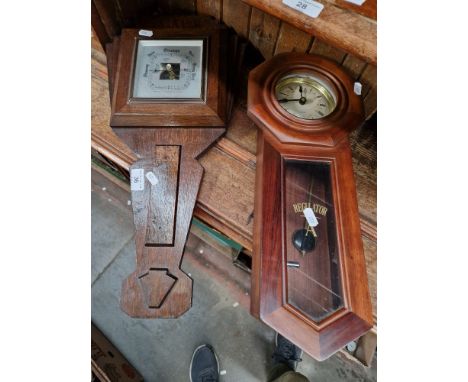 A wall clock and a barometer 