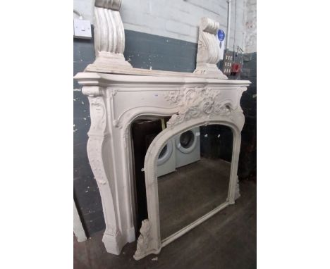 A composite ornate fire surround with matching over mantle mirror and tile cast iron insert, together with a carved wood brac