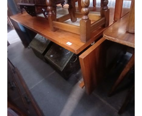 A Danish tile top teak table and eight chairs. 