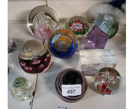 A collection of 10 glass paperweights including Caithness glass, Millefiore, etc.