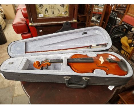 A Riff student violin with bow, in padded case.