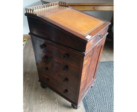 A fine Regency rosewood davenport desk, of small proportions, circa 1815, tooled leather swivel top with brass gallery rail, 