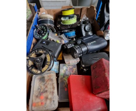 A box of approx 10fly fishing reels, flies, night vision binoculars and a spotting scopeCondition (scope & binoculars only):-