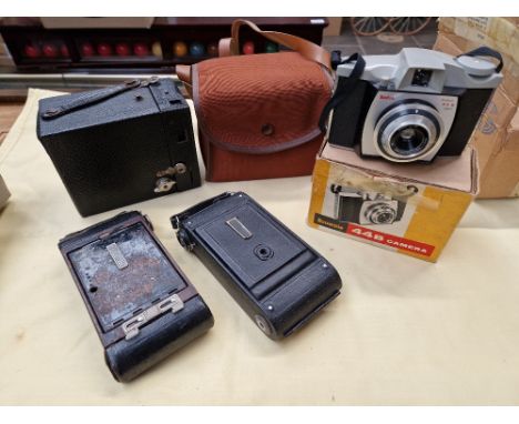 A box of vintage cameras 