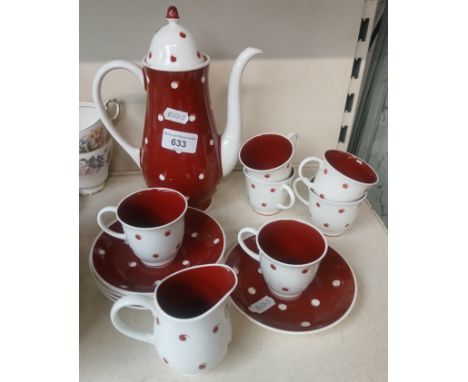 A Susie Cooper coffee set; six cups, six saucers, coffee pot and cream jug.