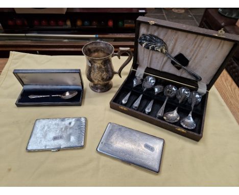 A mixed lot comprising of a hallmarked silver spoon, two cigarette cases, a tankard and a cased set of spoons.