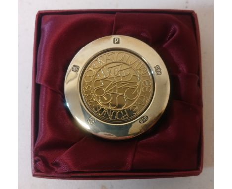 A hallmarked silver jubilee paperweight. 