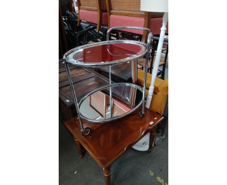 An Art Deco style trolley together with a table, mirror and a standard lamp.