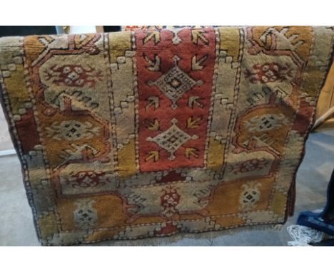 A vintage Turkish Kilim hand knotted wool carpet, cream ground, 150cm x 87cm (approx).