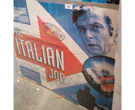 A 1999 film poster 'The Italian Job' starring Michael Caine, 92cm x 69cm. The poster is mounted between a board and a piece o