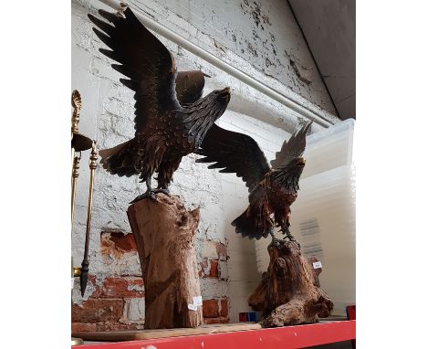 Two eagle sculptures on wooden bases.Condition:- general wear throughout, wing broken on larger one, both wings broken & glue