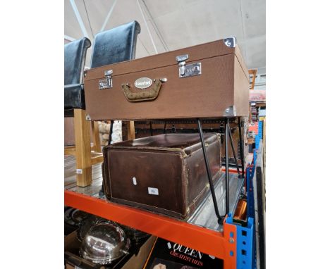 A Kaiserbach case on hairpin legs together with a vintage brown leather case. 