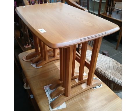 An Ercol elm nest of tables.&nbsp;Condition - good, minor wear only, largest table dimensions; width 62cm, depth 39cm &amp; h