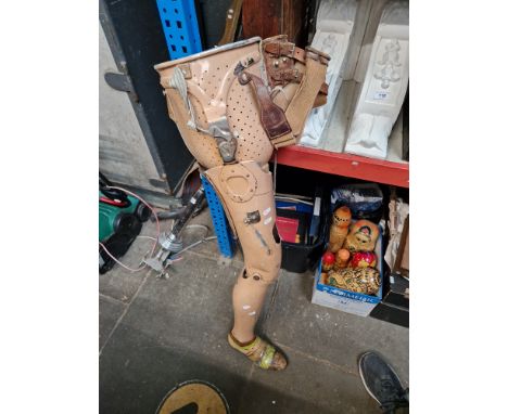 A vintage articulated lower limb prosthesis  - right leg and hip joint 