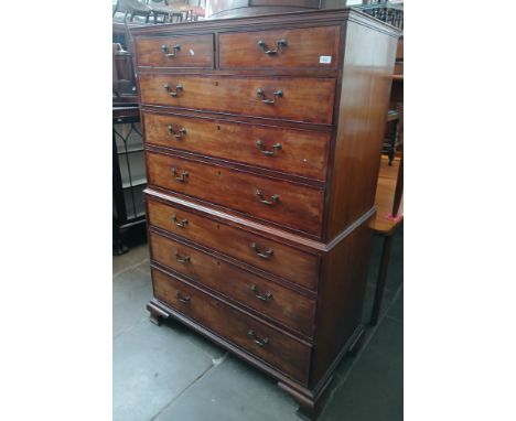 A George III 18th century mahogany chest on chest, the drawers cross banded in walnut, brass handles, ogee bracket feet, widt