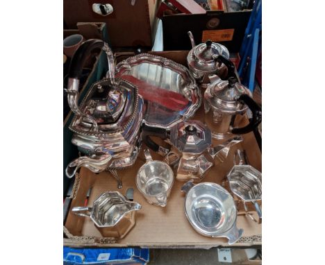 A box of silver plated ware, Walker &amp; Hall spirit kettle, three piece tea set, four piece tea set with Celtic design and 