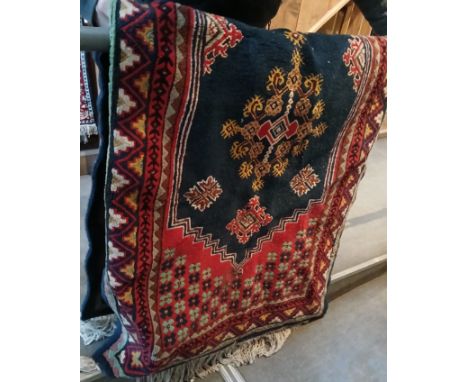 A vintage Turkish Kilim hand knotted wool carpet, blue ground, 230cm x 101cm (approx). Condition- good overall, some slight m