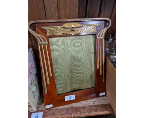 An early 20th century Art Nouveau mahogany and gilt metal picture frame with Egyptian Revival detail.&nbsp;Condition - back r