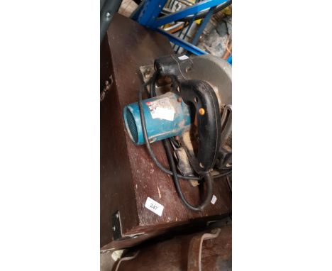 A joiners toolbox with contents and a Makita circular saw 