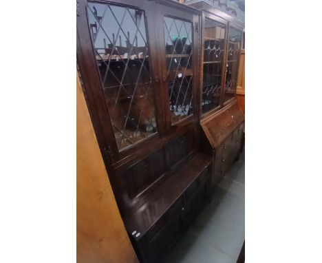 An oak bureau bookcase and a leaded glass lounge cabinet. 