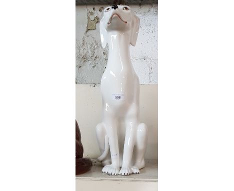 An Italian ceramic whippet statue, 51cm height.