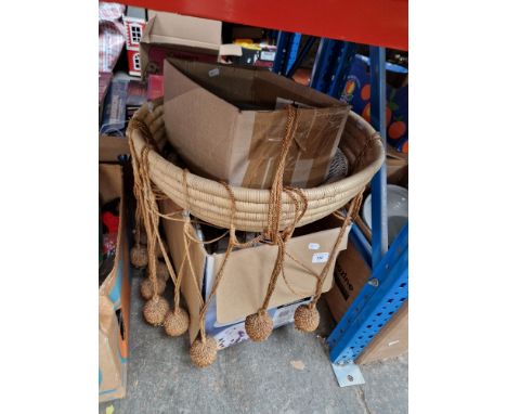 A mixed lot comprising wicker hanging basket, beaded ceiling light fitting, shells fitted with lights, etc.