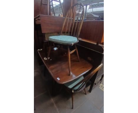 An Ercol drop leaf table and four chairs. 