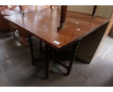 A bobbin turned oak gate leg table, circa 1900.