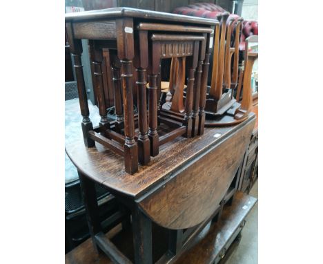 An oak gate leg table together with two nests of tables and an occasional table. 