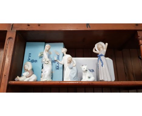 Lladro porcelain - 5 figurines including 3 boxed: â€˜Girl trying on a Straw Hatâ€™ (5011) designed by Francisco Catala, â€˜Se