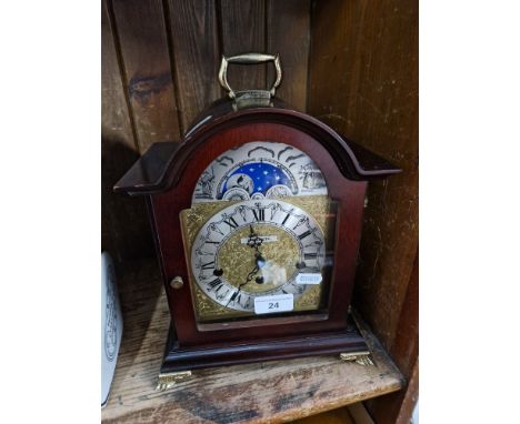 A Hermle mantle clock, 26cm high.