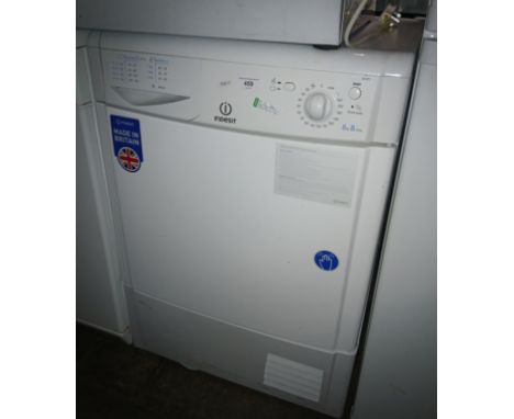 An Indesit dryer &amp; a small Logik fridge 