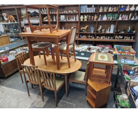 A mixed lot of mid 20th century teak furniture comprising two tables and chairs, TV stand, tile top nest of tables and a G Pl