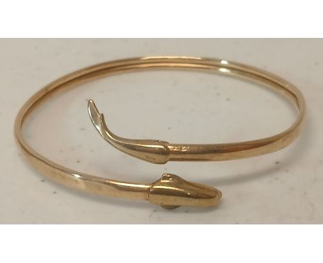 A hallmarked 9ct gold dolphin bangle, weight 5.9g.