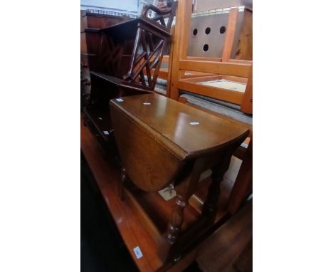 A reproduction wall shelf and a small oak drop leaf table. 