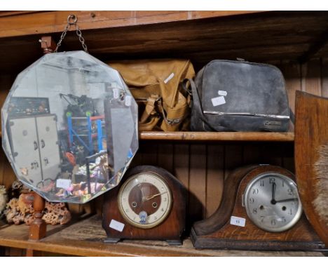 A mixed lot comprising two mantle clocks, vintage mirror, leather bowls bag, 8mm cine camera.