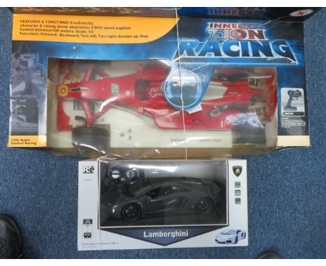 Remote Control pair with 1/6th scale F1-style red racing car with controller No. 1601 and 1/14th scale Lamborghini Aventador 
